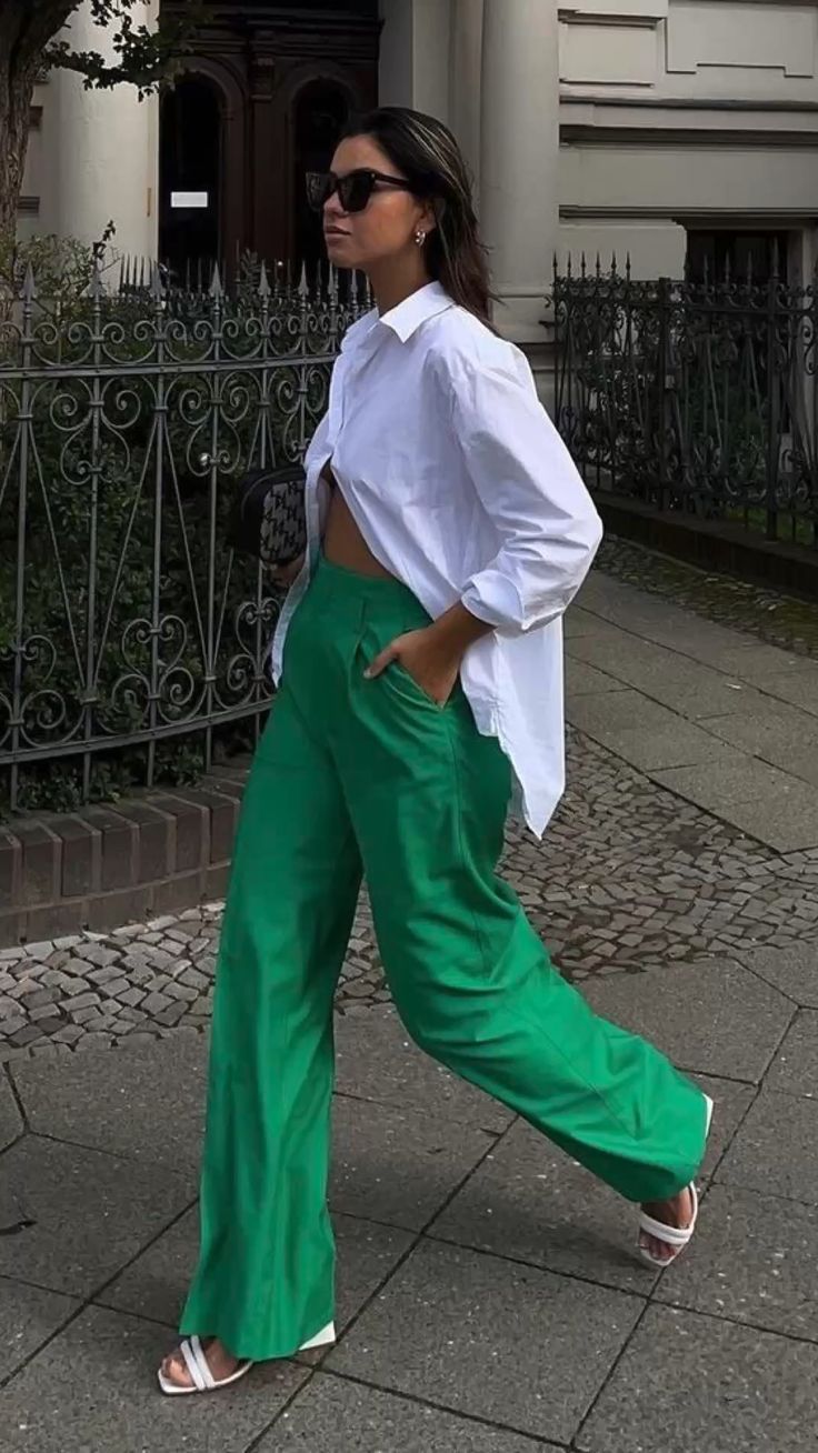 white shirt paired with green wide-leg pants and white sandals